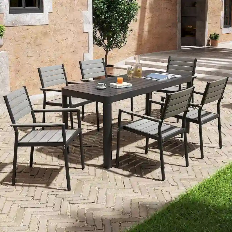 Set da pranzo per esterni a 5/7 posti con sedie impilabili e tavolo allungabile in alluminio